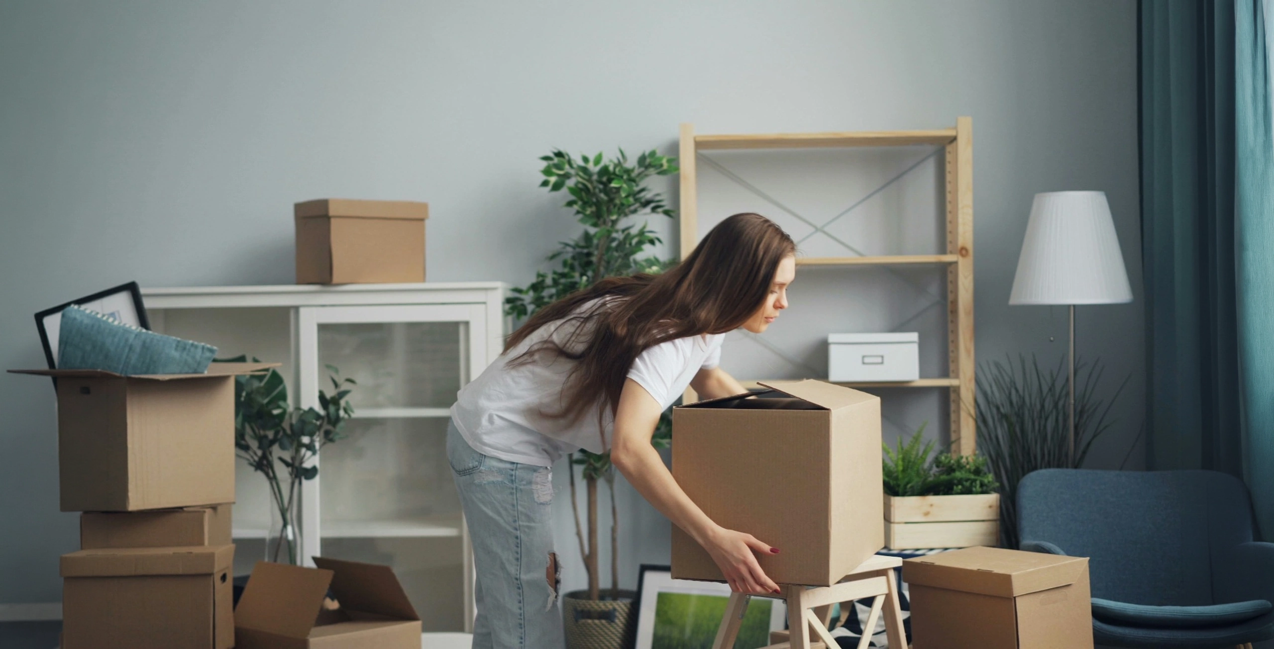 Home packing with moving boxes in a living room