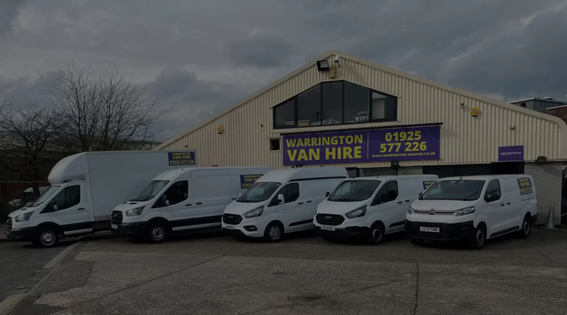 A clean white Luton tail lift van with the lift deployed, parked ready for loading bulky furniture and heavy commercial goods in Warrington