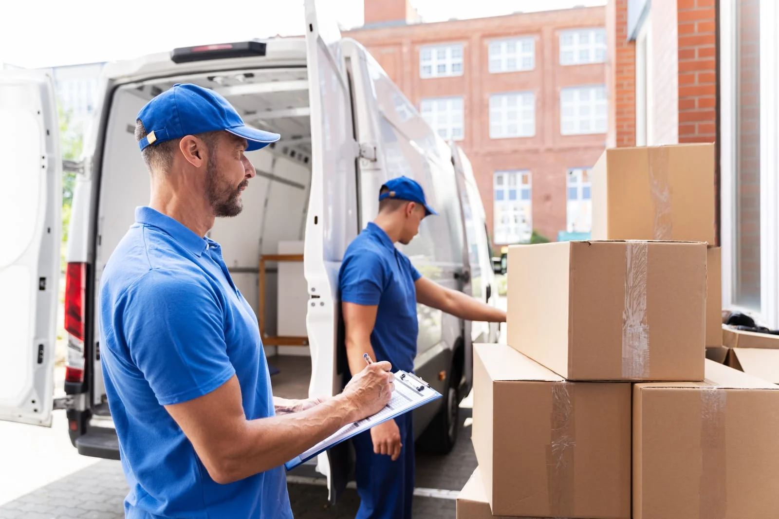 Local van hire customers loading a van in Warrington