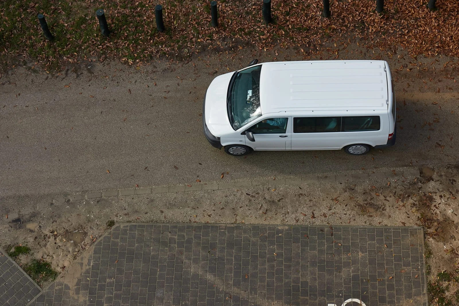 White hire van on a quiet road near Golborne