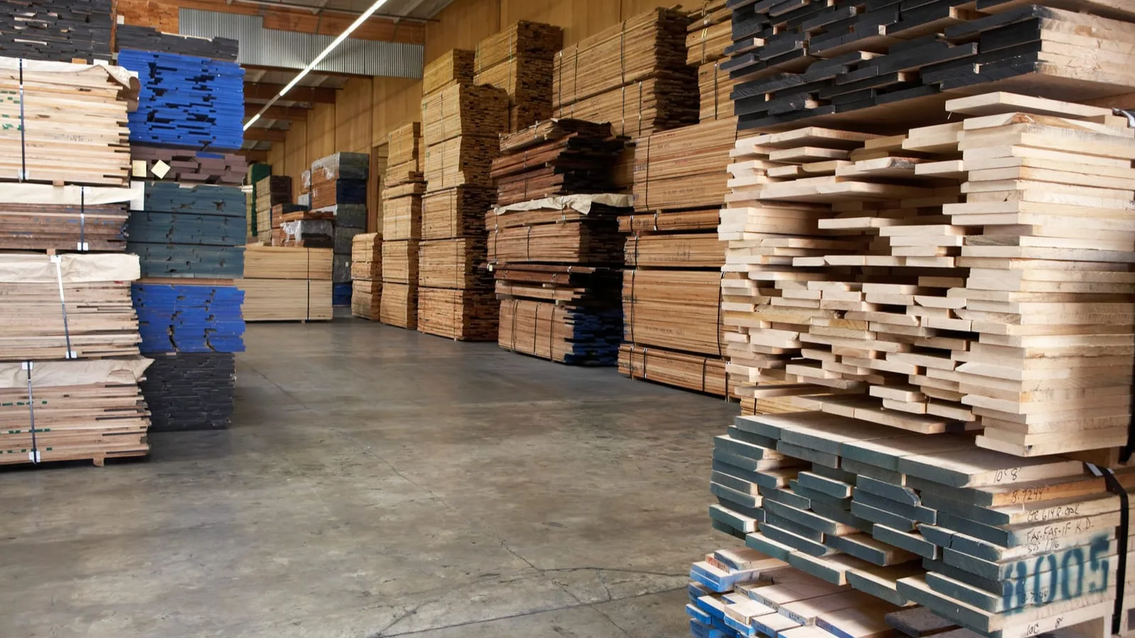 Stacks of timber in a merchant warehouse ready for a builders merchant collection