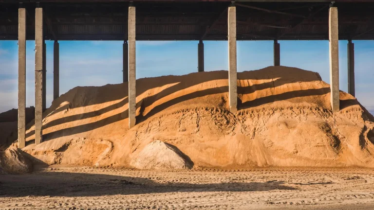 Sand and aggregate at a supplier yard | Warrington Van Hire | Central Warrington Van Hire | Call 01925 396 222 Sand and aggregate stored under a canopy at a supplier yard, ready for bulk bag collection