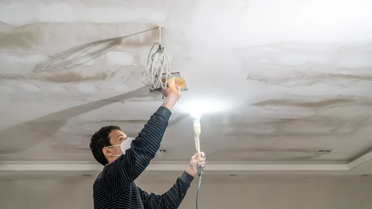 Finishing a plasterboard ceiling | Warrington Van Hire | Central Warrington Van Hire | Call 01925 396 222 Worker finishing a plasterboard ceiling, the end of a job that starts with plasterboard van hire